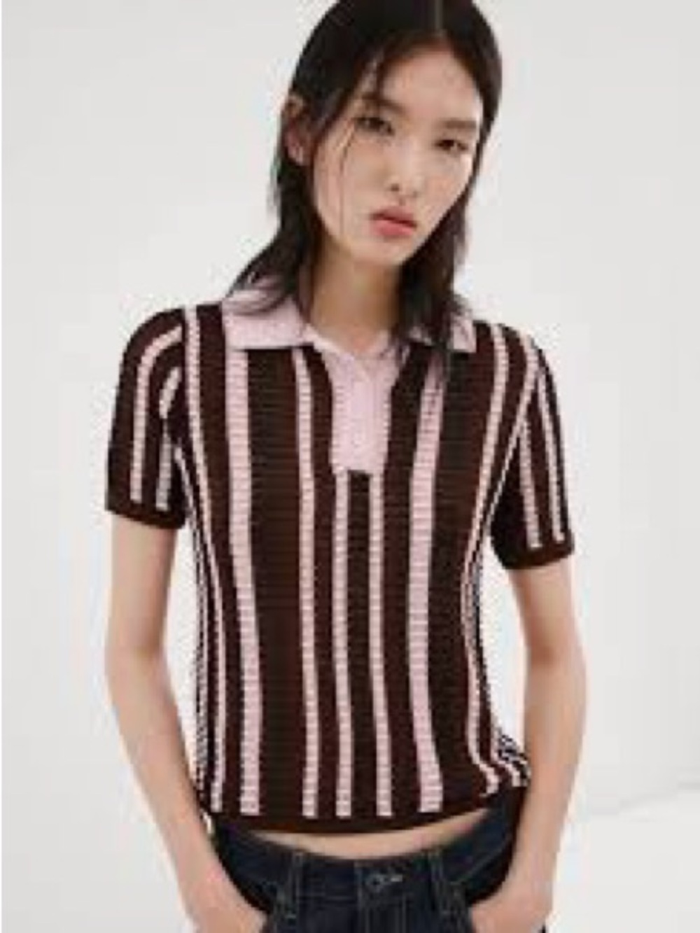 Zara polo shirt features a textured knit design and a button-up collar.